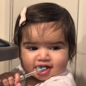 A child brushing her teeth